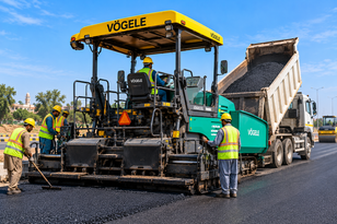 Road construction and paving equipment on site